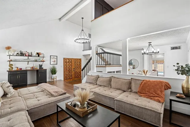 a living room with furniture fireplace and a flat screen tv