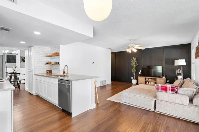 a view of a backyard with a barbeque grill and a lake view