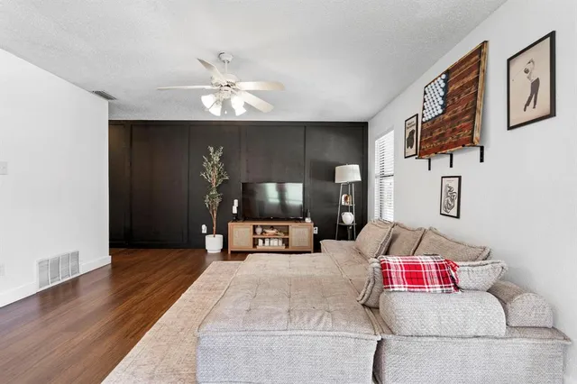 a large white kitchen with cabinets a sink and a stove