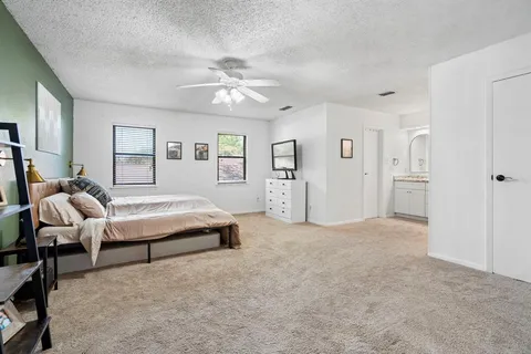 a bathroom with double vanity sink and mirror