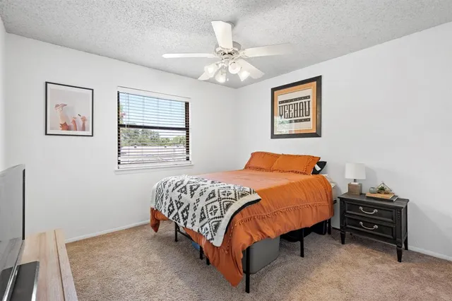 a bathroom with a toilet and shower