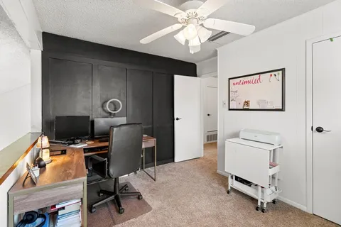 a view of a workspace with furniture