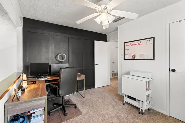 a view of a workspace with furniture