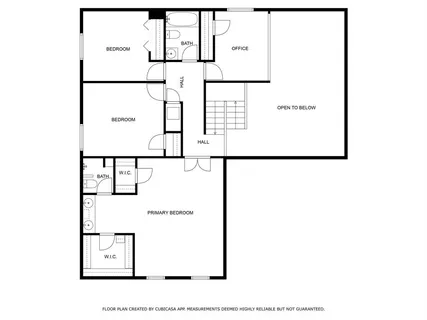 a picture of a bench in front of a gate