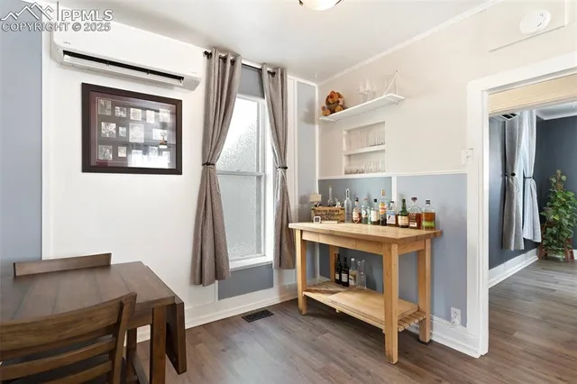 a kitchen with stainless steel appliances a stove a sink a refrigerator a window and cabinets