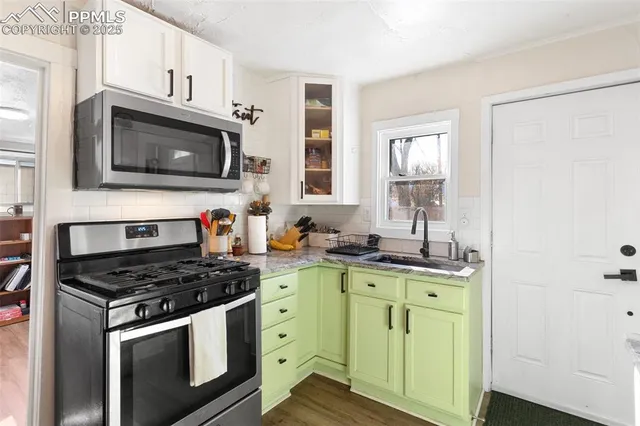 a bedroom with a bed and a wooden floor