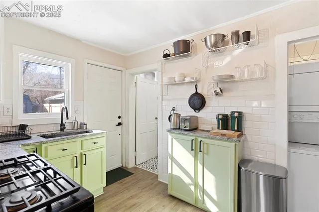 a bedroom with a bed and a potted plant
