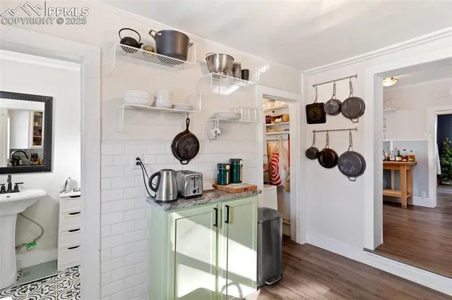 a bedroom with a bed and a potted plant