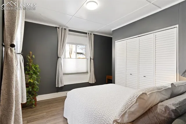 a bathroom with a sink mirror and a toilet