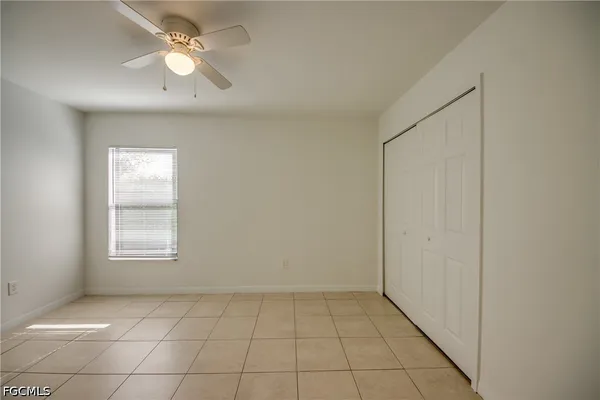 a house that has a tree in front of it