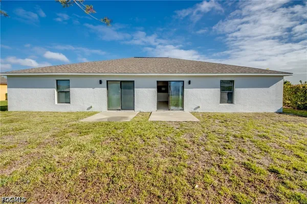 a view of a swimming pool with a yard