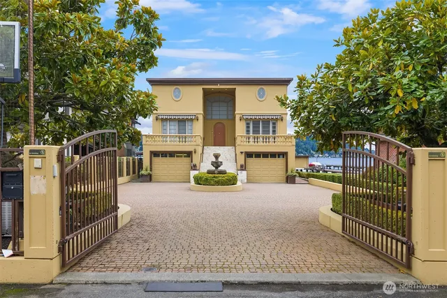 a view of a house with wooden fence