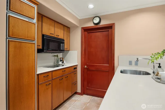 a kitchen with stainless steel appliances a refrigerator stove and sink