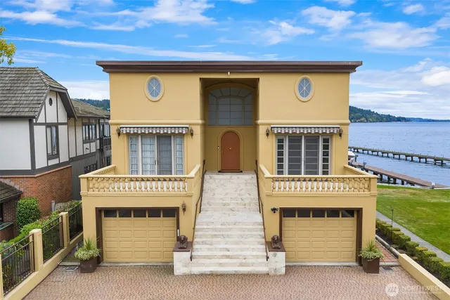 a front view of a house with a garage
