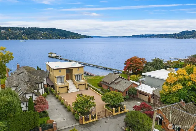 an aerial view of a house with a lake view