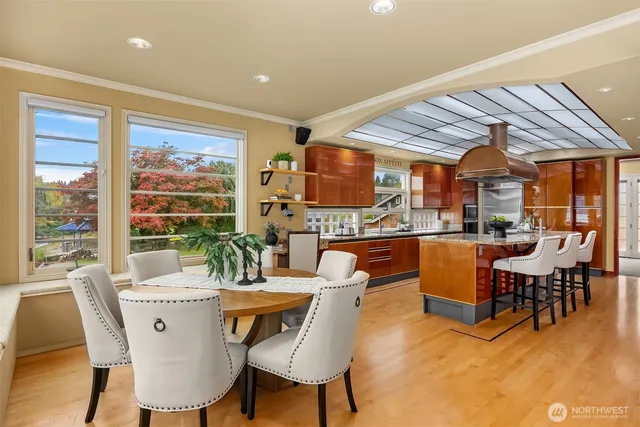 a dining room with furniture and wooden floor