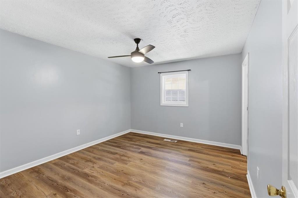 1500 Moores Ferry Road Southwest Plainville, GA 30733 - Photo 32 of 33 a view of a room with wooden floor and windows