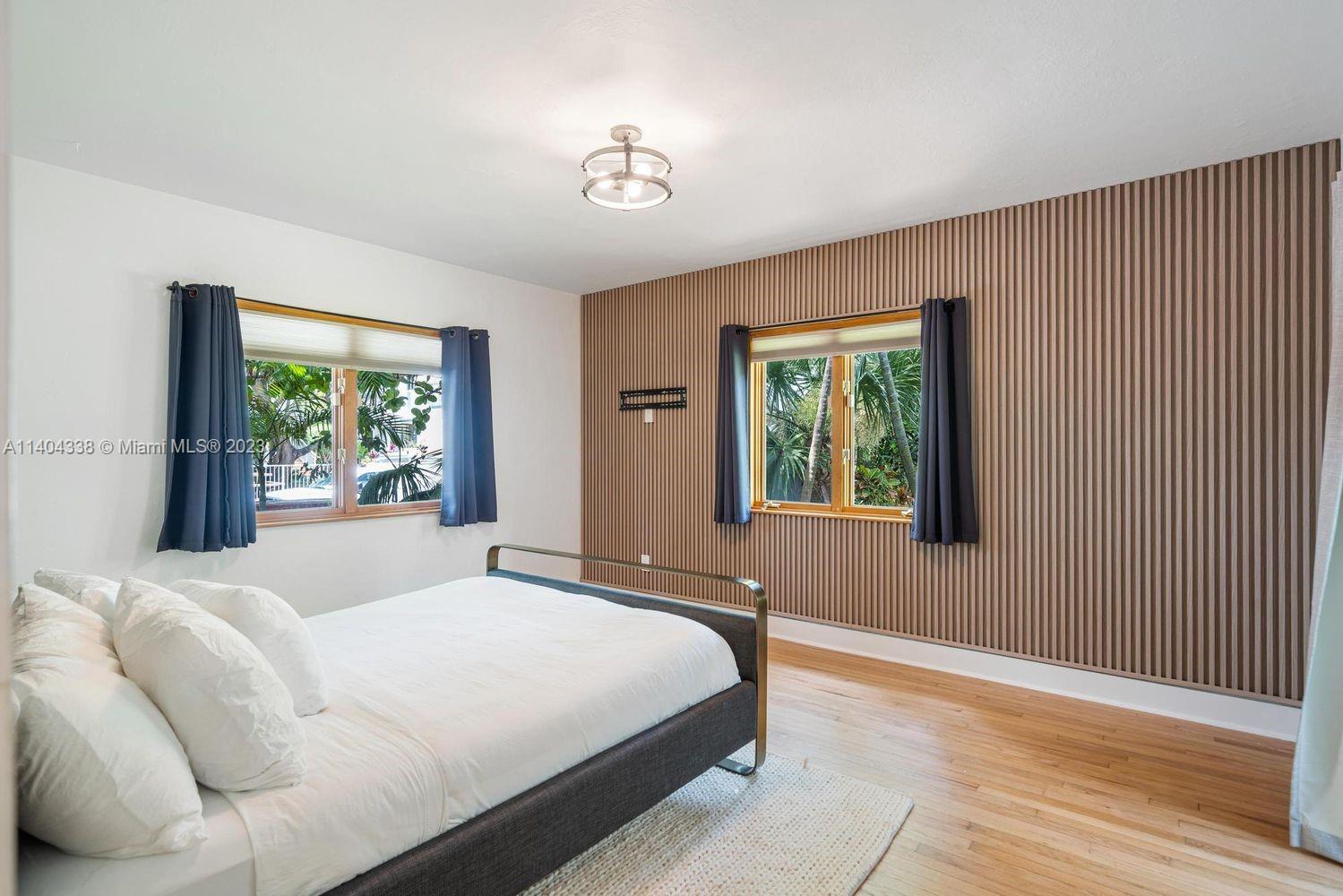 2500 Flamingo Drive Miami Beach, FL 33140 - Photo 11 of 27 a bedroom with a large bed and a window