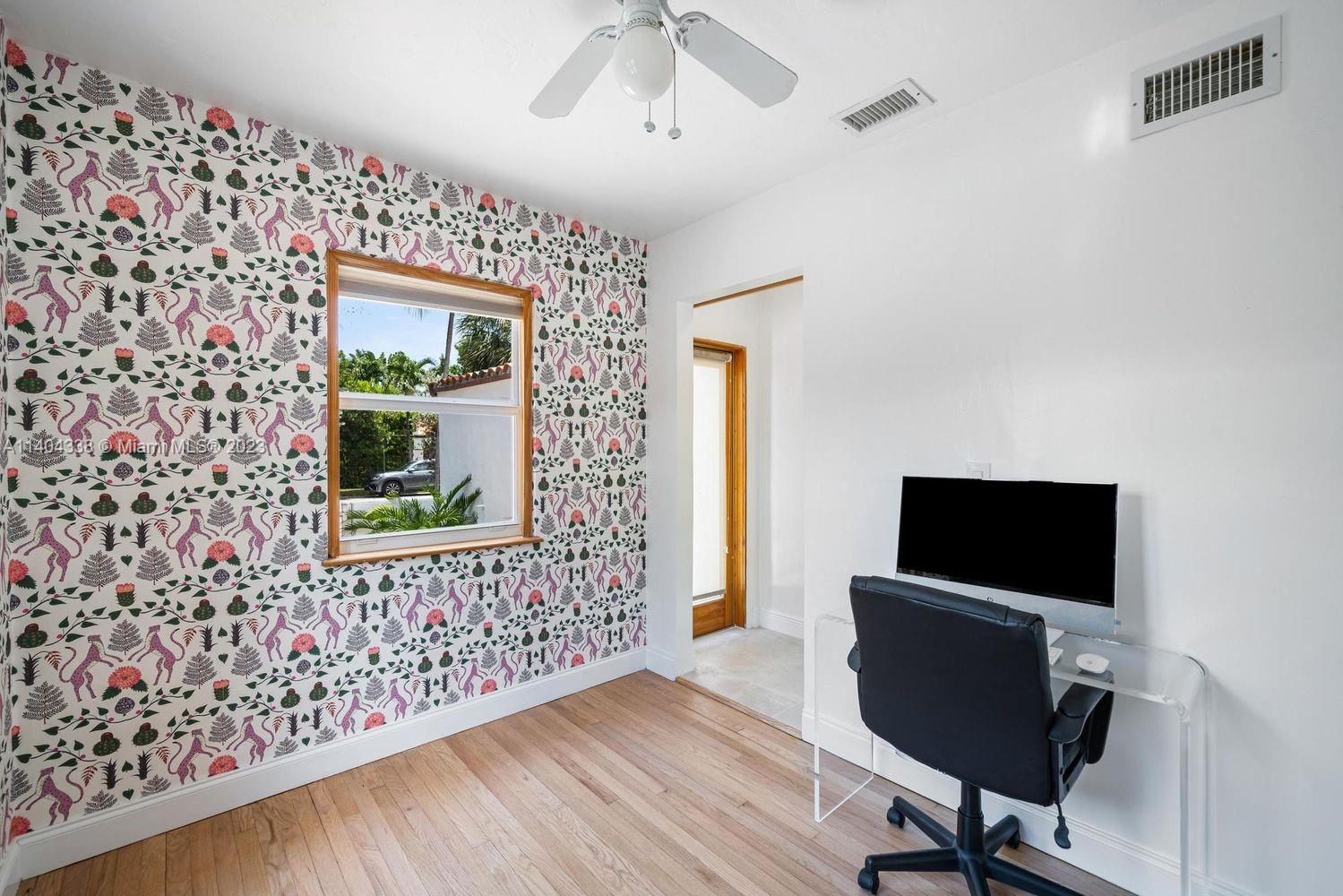 2500 Flamingo Drive Miami Beach, FL 33140 - Photo 15 of 27 a view of a workspace with furniture and a window