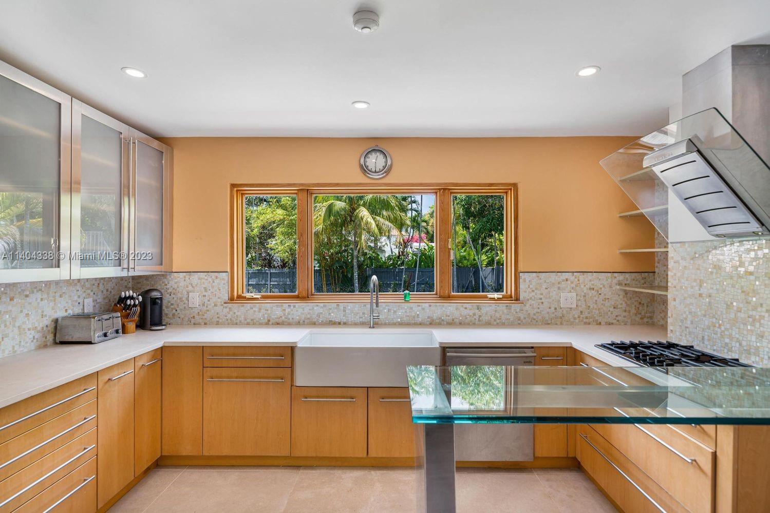 2500 Flamingo Drive Miami Beach, FL 33140 - Photo 16 of 27 a kitchen with a sink and a large window