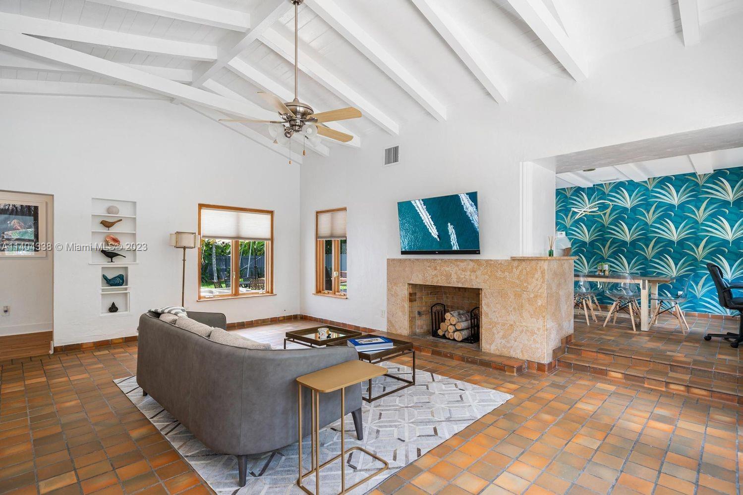 2500 Flamingo Drive Miami Beach, FL 33140 - Photo 5 of 27 a living room with furniture and a fireplace