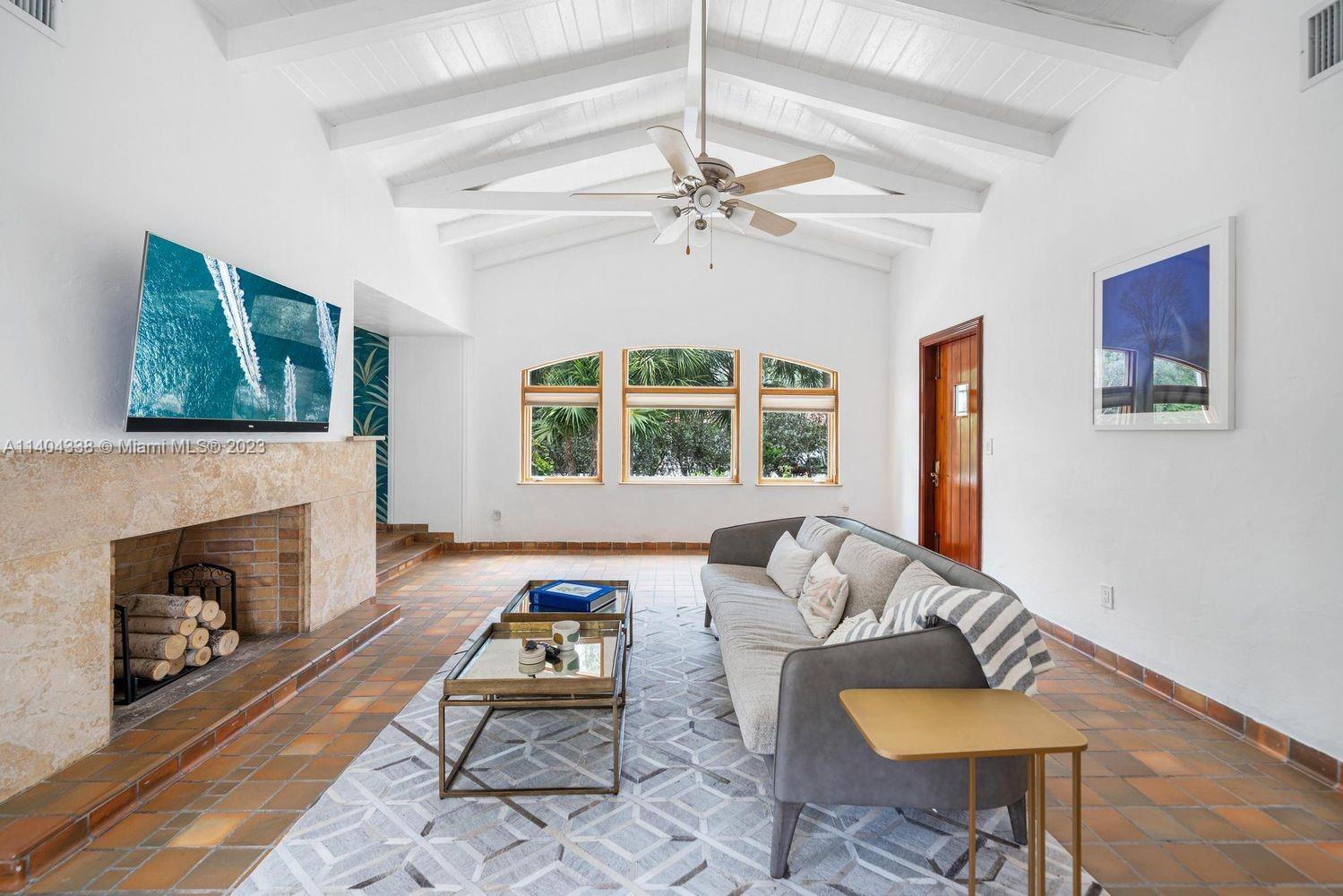 2500 Flamingo Drive Miami Beach, FL 33140 - Photo 6 of 27 a living room with furniture and a fireplace