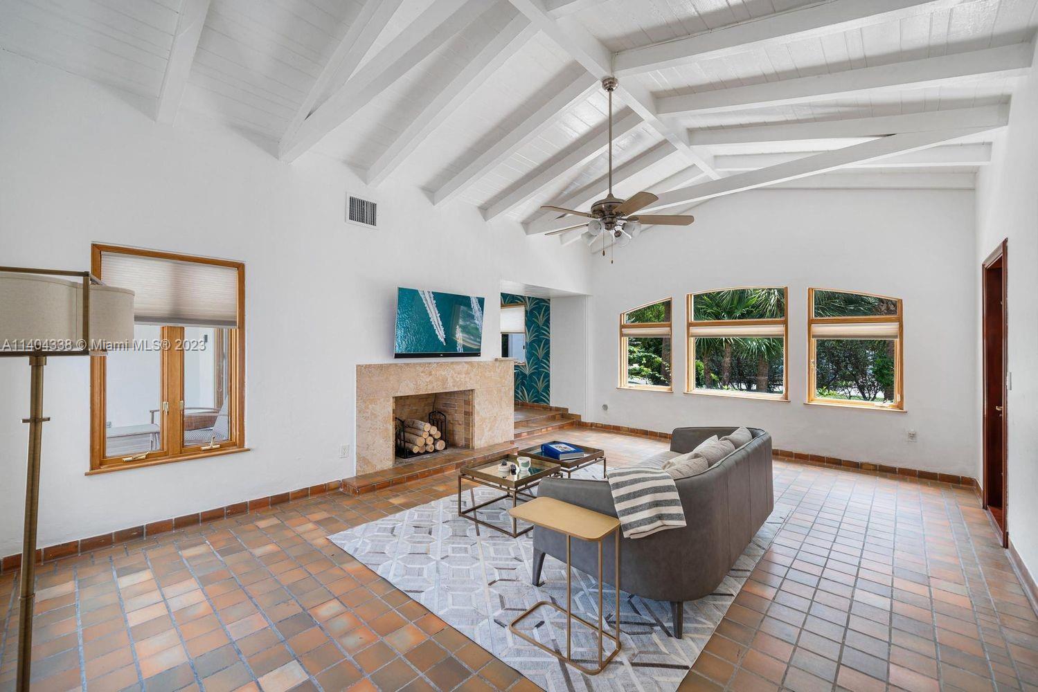 2500 Flamingo Drive Miami Beach, FL 33140 - Photo 7 of 27 a living room with furniture and a fireplace