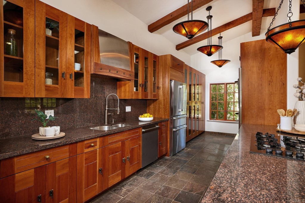 2931 Lone Jack Road Encinitas, CA 92024 - Photo 15 of 40 a kitchen with stainless steel appliances granite countertop a sink and cabinets