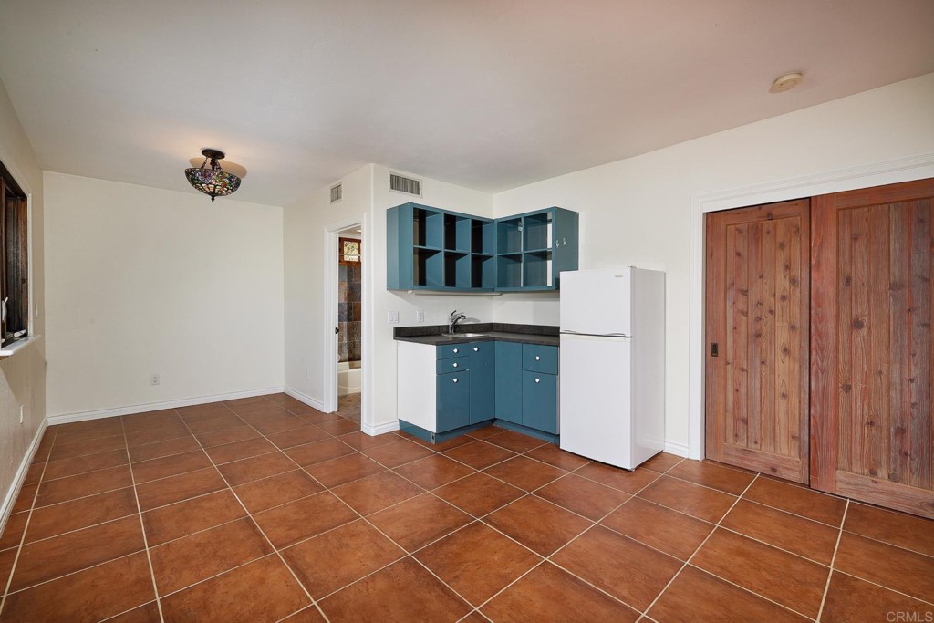 2931 Lone Jack Road Encinitas, CA 92024 - Photo 23 of 40 a view of kitchen with furniture and window