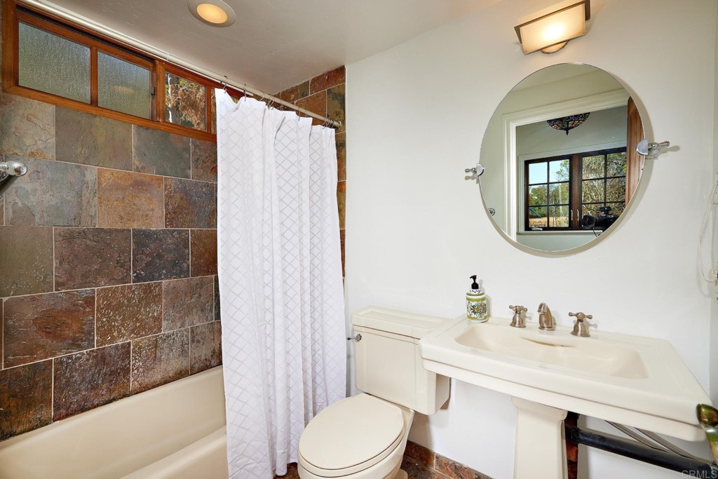 2931 Lone Jack Road Encinitas, CA 92024 - Photo 25 of 40 a bathroom with a sink toilet and shower