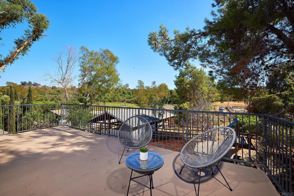 2931 Lone Jack Road Encinitas, CA 92024 - Photo 27 of 40 a view of a chairs and table in patio