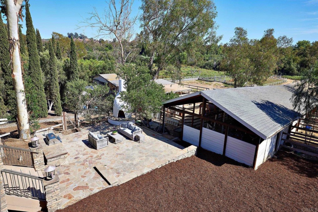 2931 Lone Jack Road Encinitas, CA 92024 - Photo 28 of 40 a view of a patio with furniture and a yard