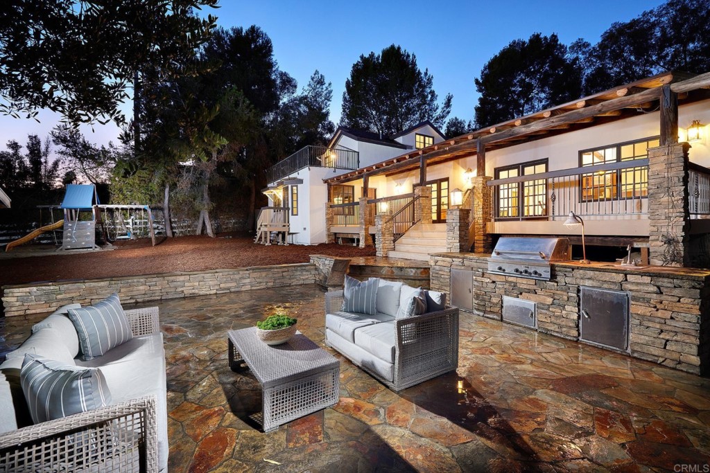 2931 Lone Jack Road Encinitas, CA 92024 - Photo 3 of 40 a view of a patio with couches table and chairs and potted plants