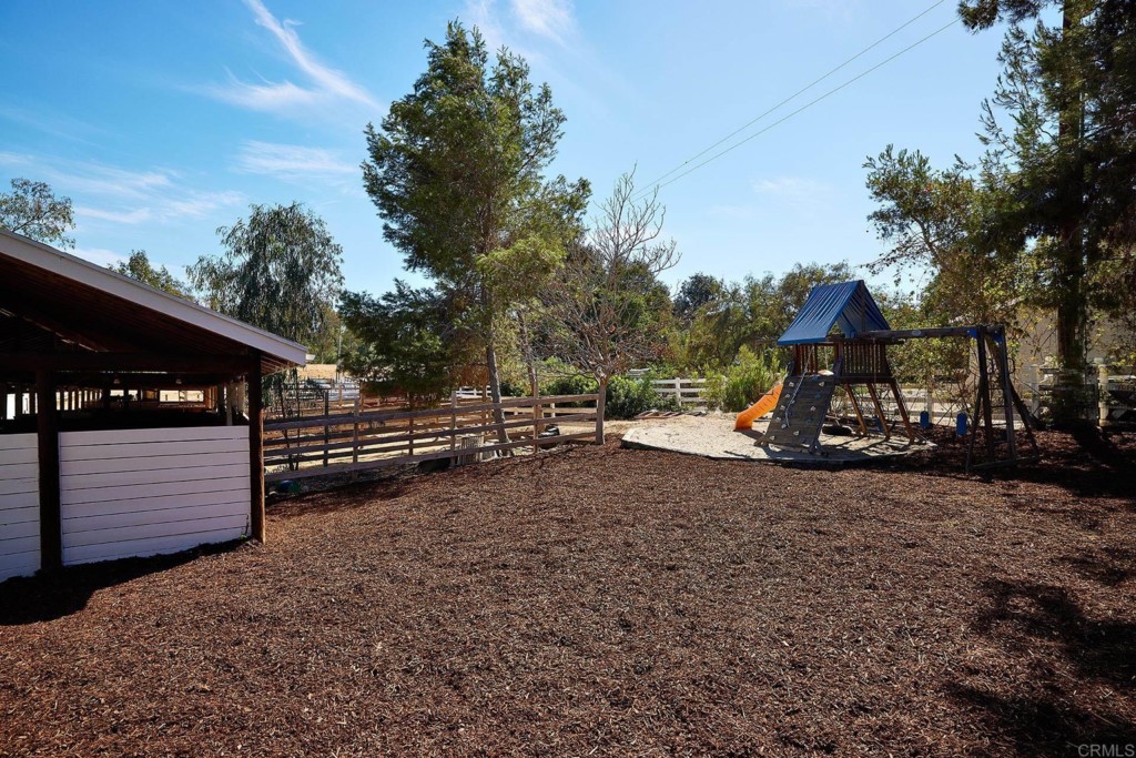 2931 Lone Jack Road Encinitas, CA 92024 - Photo 33 of 40 a view of a bench in a backyard