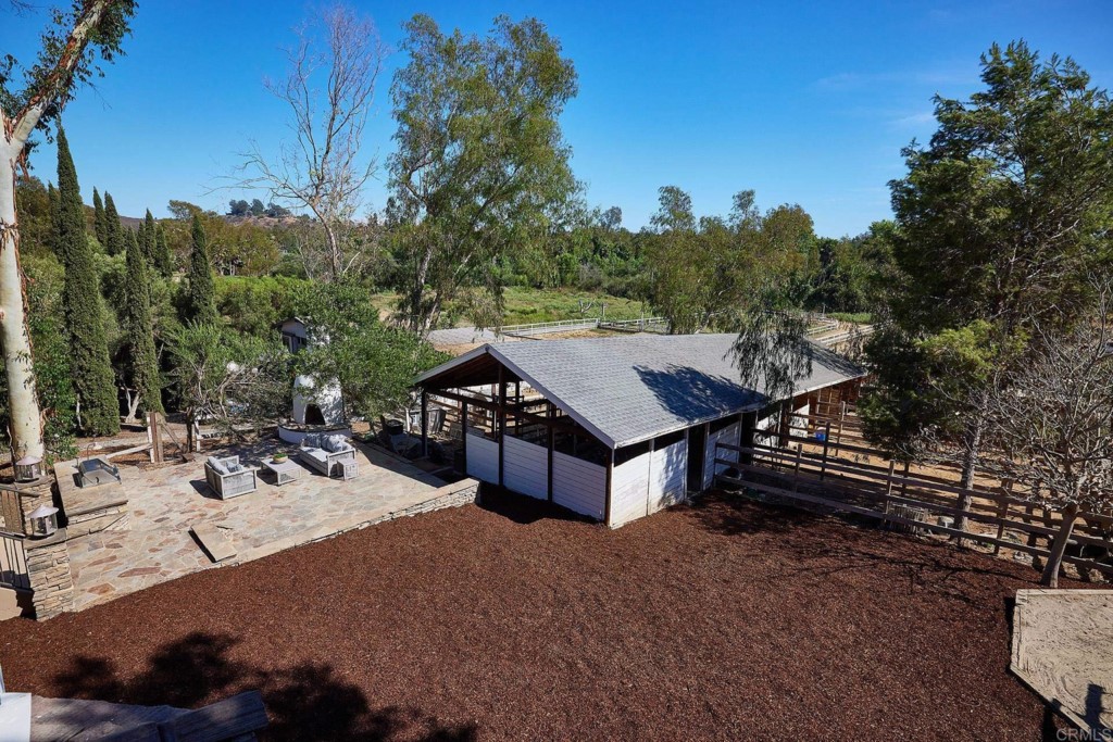 2931 Lone Jack Road Encinitas, CA 92024 - Photo 34 of 40 a view of a dinning table and chairs in the patio