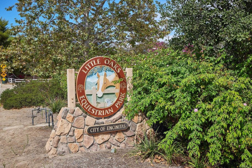 2931 Lone Jack Road Encinitas, CA 92024 - Photo 38 of 40 a sign board with a garden