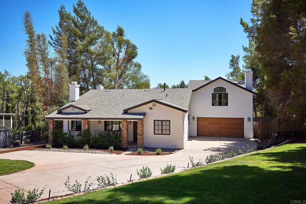 2931 Lone Jack Road Encinitas, CA 92024 - Photo 5 of 40 a front view of a house with a garden and yard