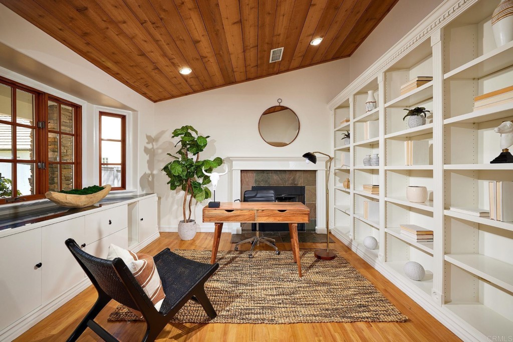 2931 Lone Jack Road Encinitas, CA 92024 - Photo 7 of 40 a living room with furniture a rug and a potted plant