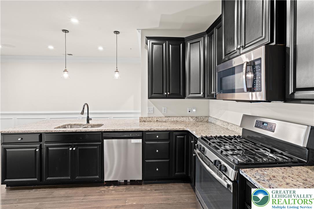 4758 Rafi Road Easton, PA 18045 - Photo 11 of 55 Granite counters and stainless steel appliances complete this well-appointed kitchen, ready for culinary creations.
