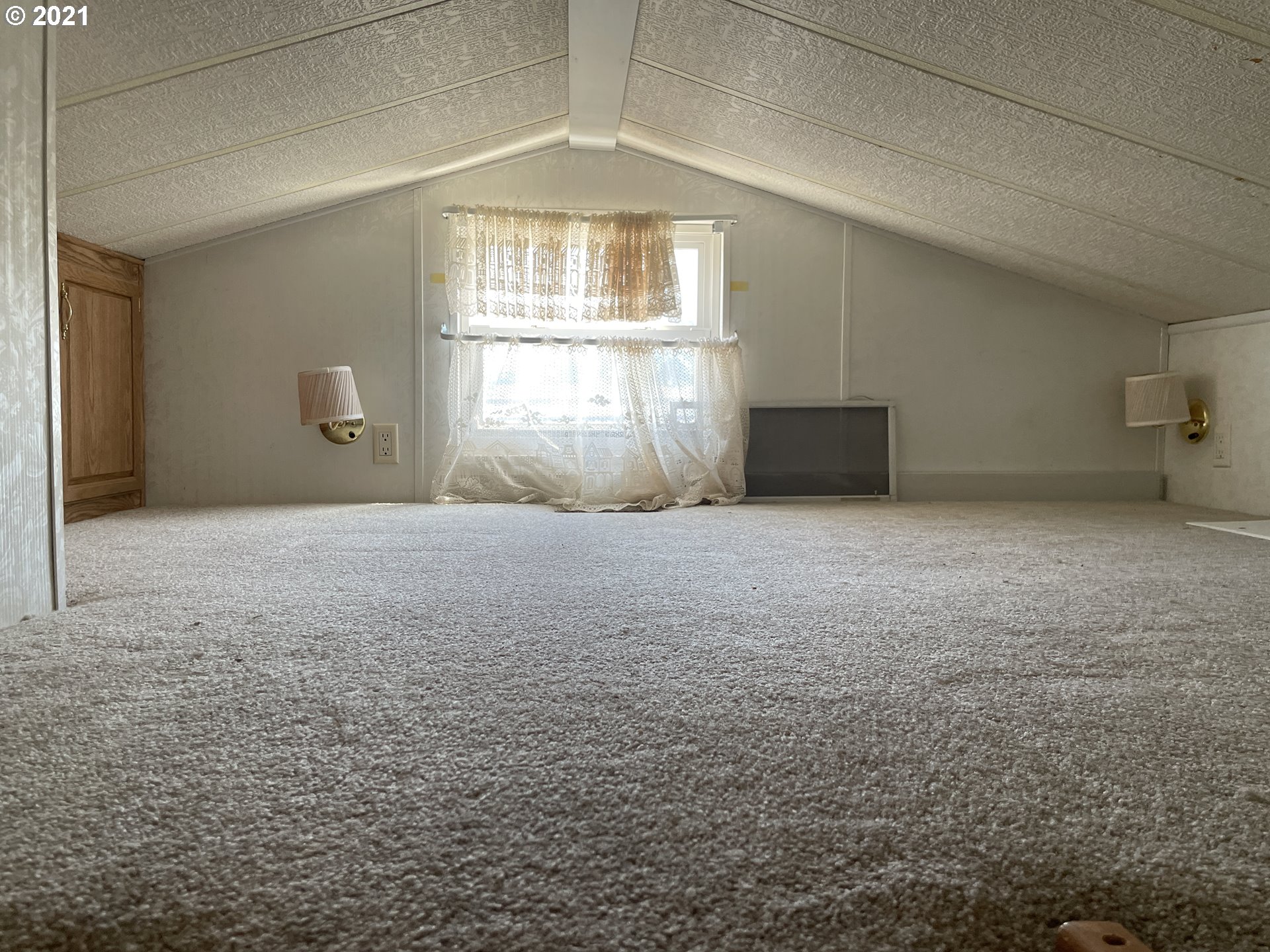 19776 Southeast Stark Street Portland, OR 97233 - Photo 13 of 18 a view of an empty room with a window