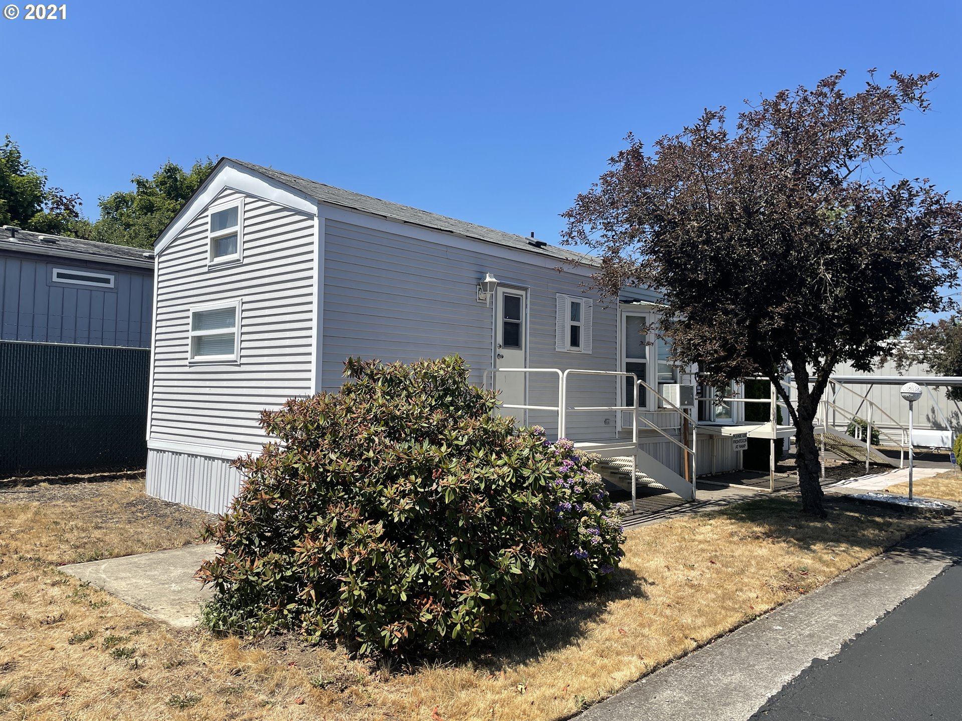 19776 Southeast Stark Street Portland, OR 97233 - Photo 18 of 18 a view of a house with a yard