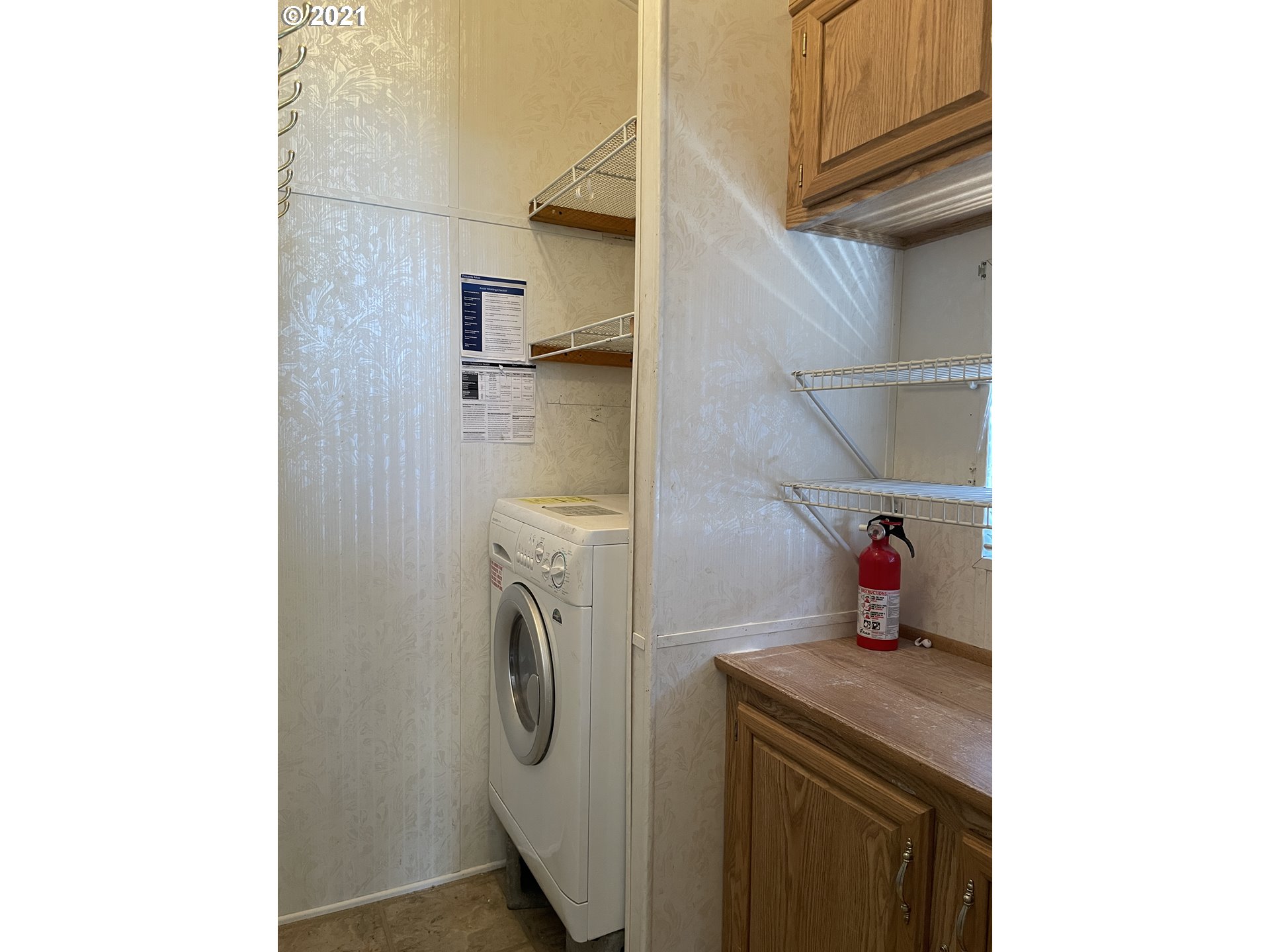19776 Southeast Stark Street Portland, OR 97233 - Photo 10 of 18 a utility room with dryer and washer