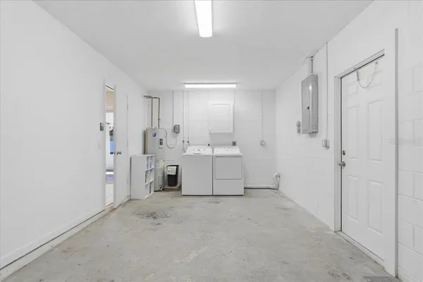 a aerial view of a brick house with a yard