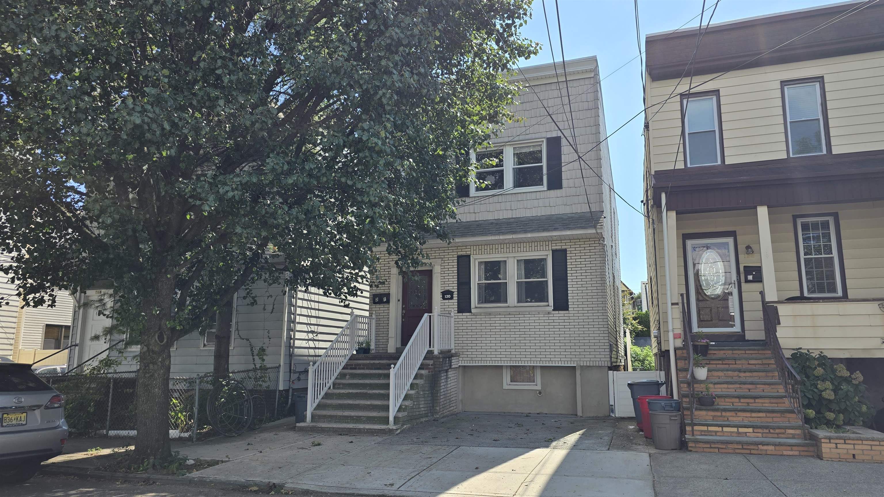 a front view of a house with stairs