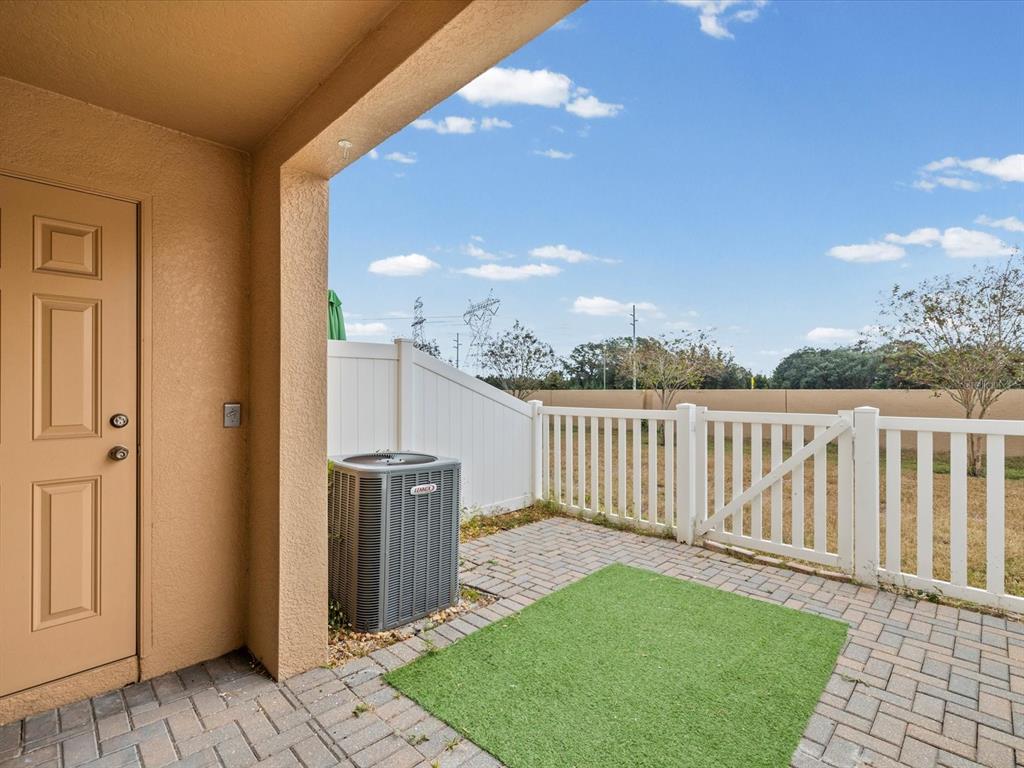 9779 Trumpet Vine Loop Trinity, FL 34655 - Photo 28 of 33 a view of a deck with a backyard