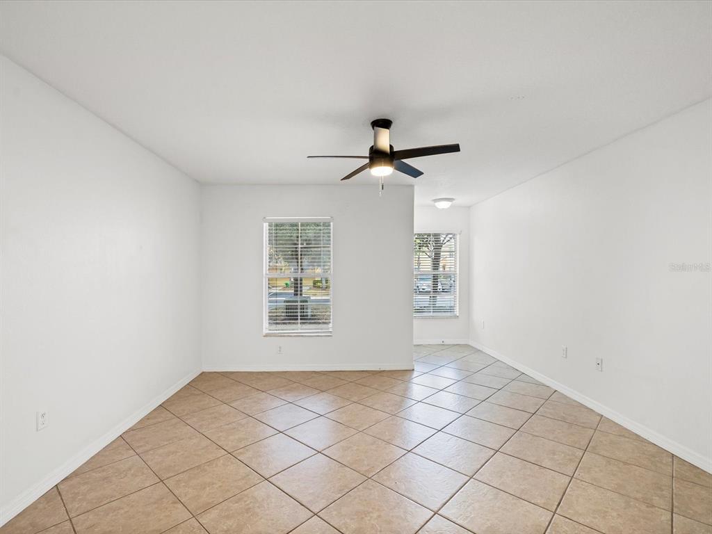 9779 Trumpet Vine Loop Trinity, FL 34655 - Photo 4 of 33 a view of an empty room with a window