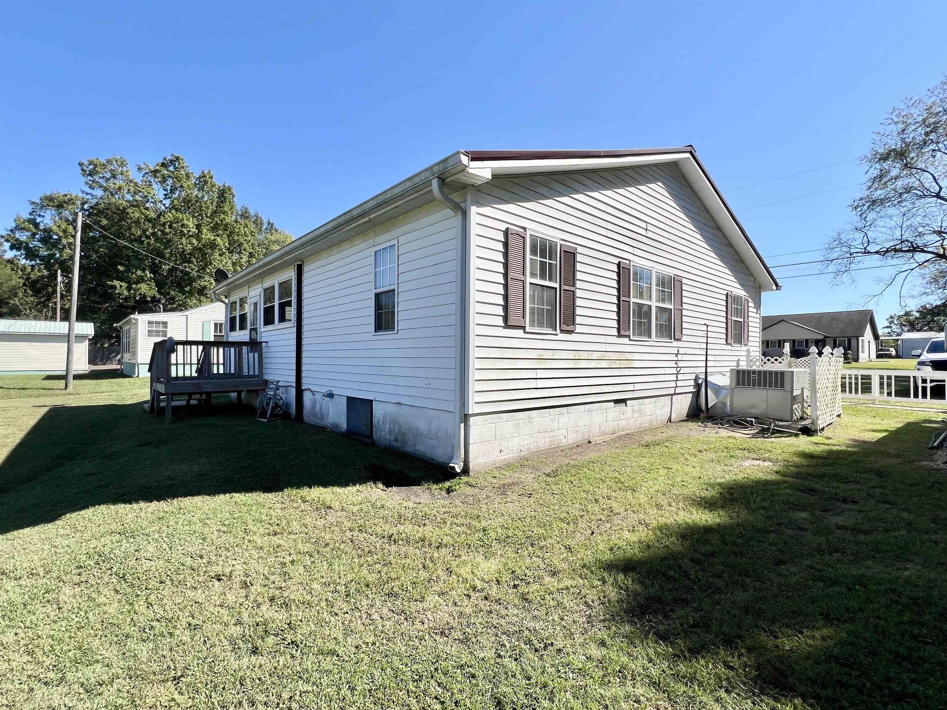 206 Willow Drive Adamsville, TN 38310 - Photo 14 of 21 a front view of a house with a yard