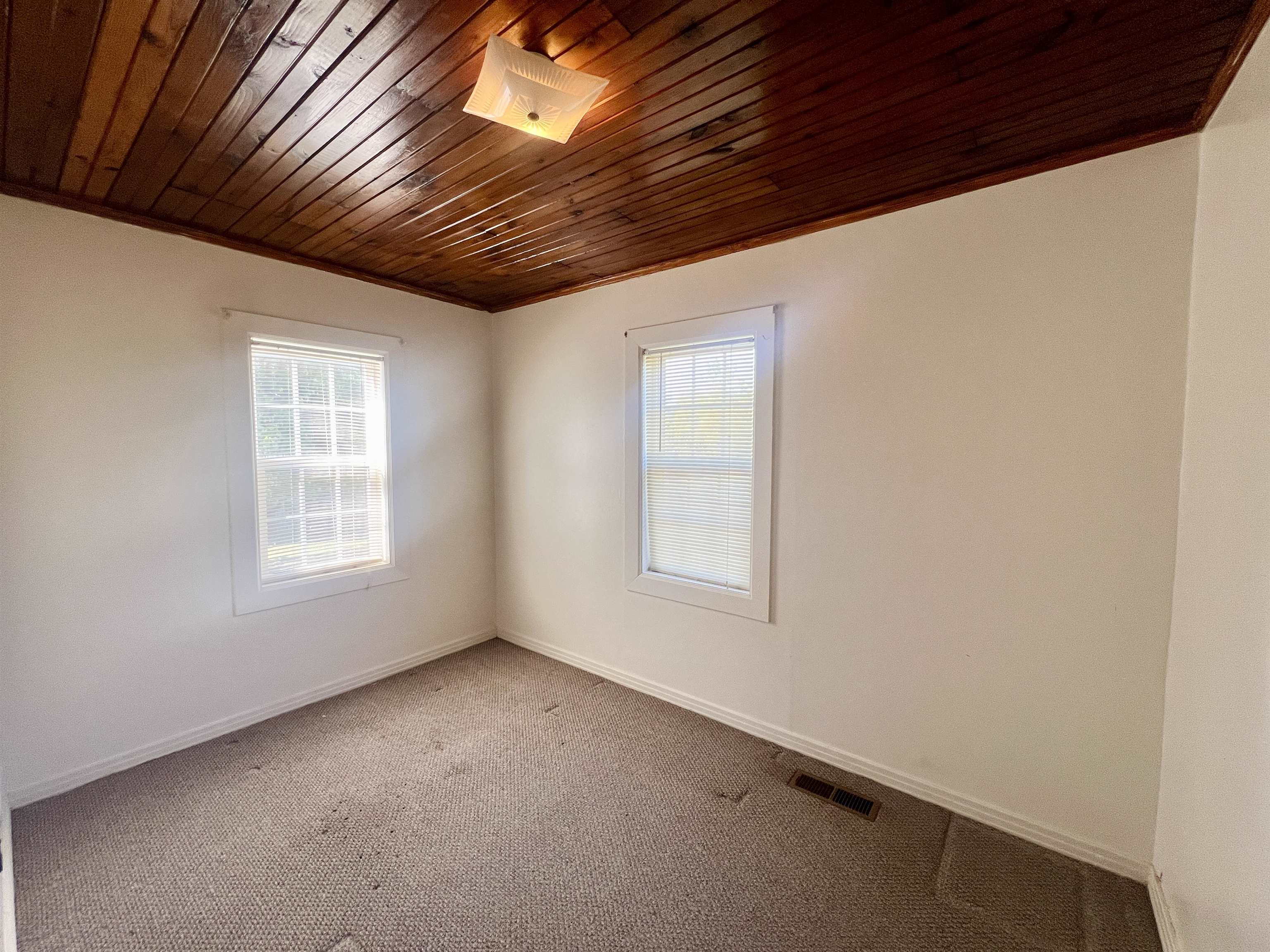 206 Willow Drive Adamsville, TN 38310 - Photo 4 of 21 an empty room with windows