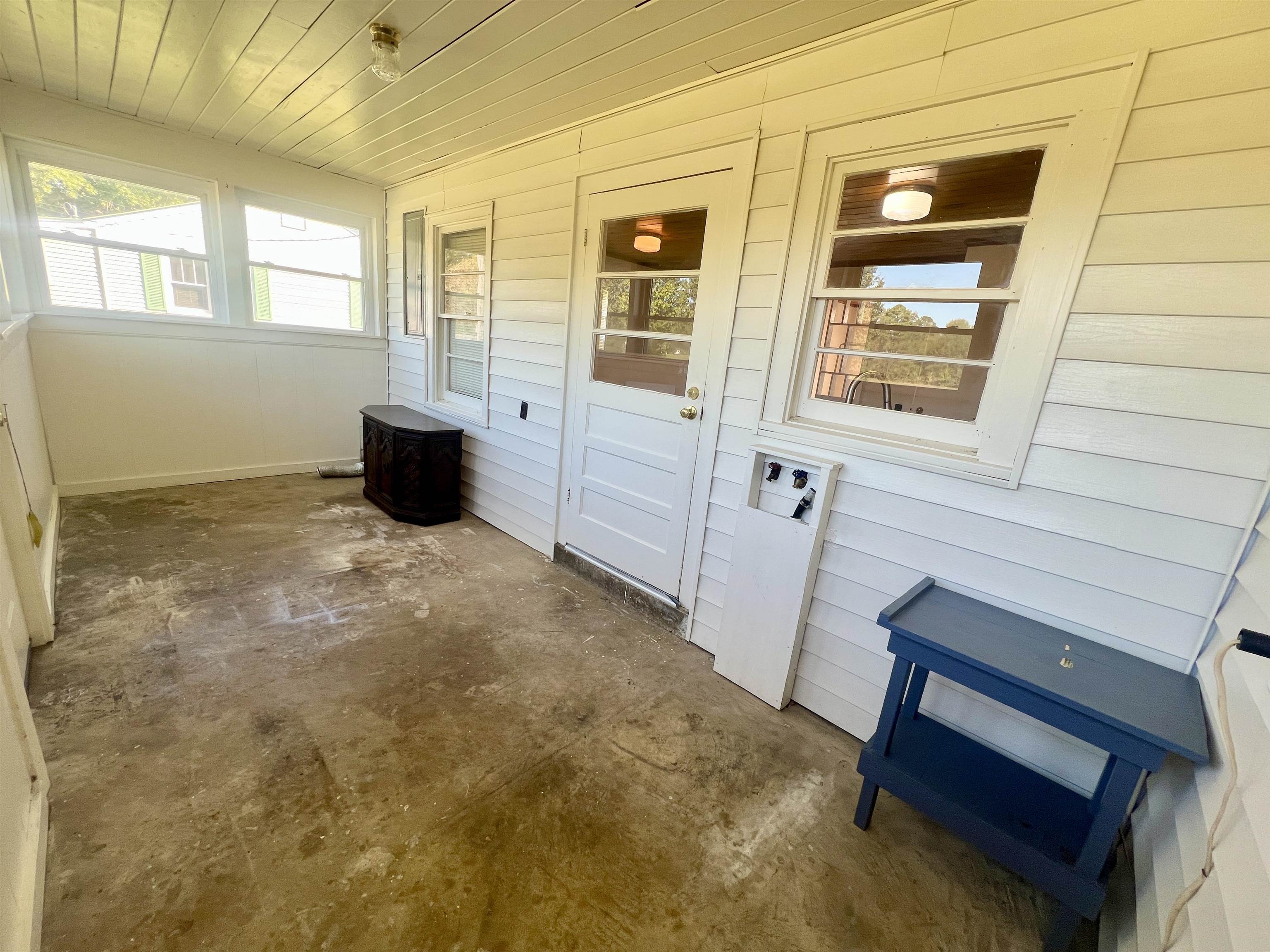 206 Willow Drive Adamsville, TN 38310 - Photo 8 of 21 a view of an empty room with a window