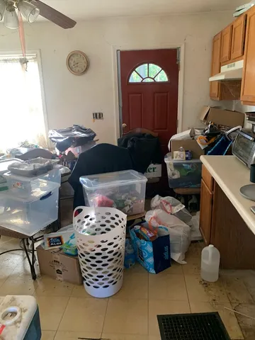 a room with a couch and a chandelier